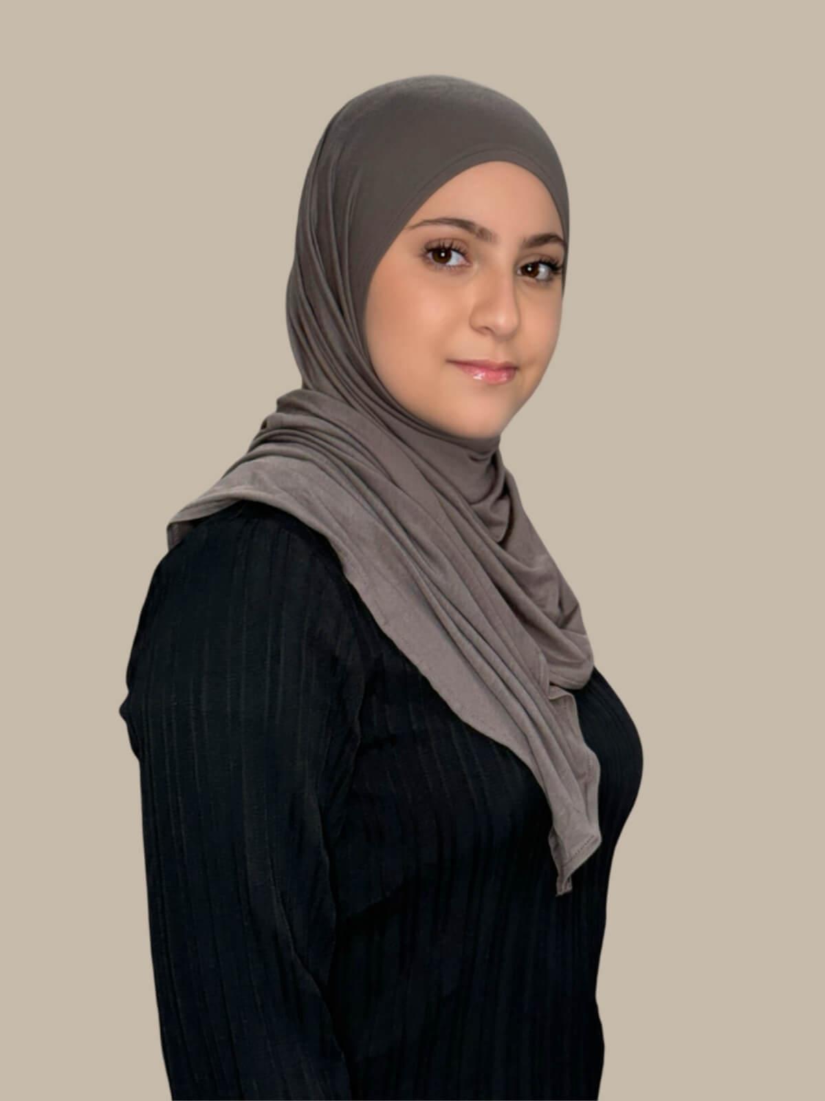 Hazel Pre-Sewn Jersey Hijab in Modish Girl size, side view on model with hijab wrapped neatly around shoulders showing smooth fit and soft stretch fabric.