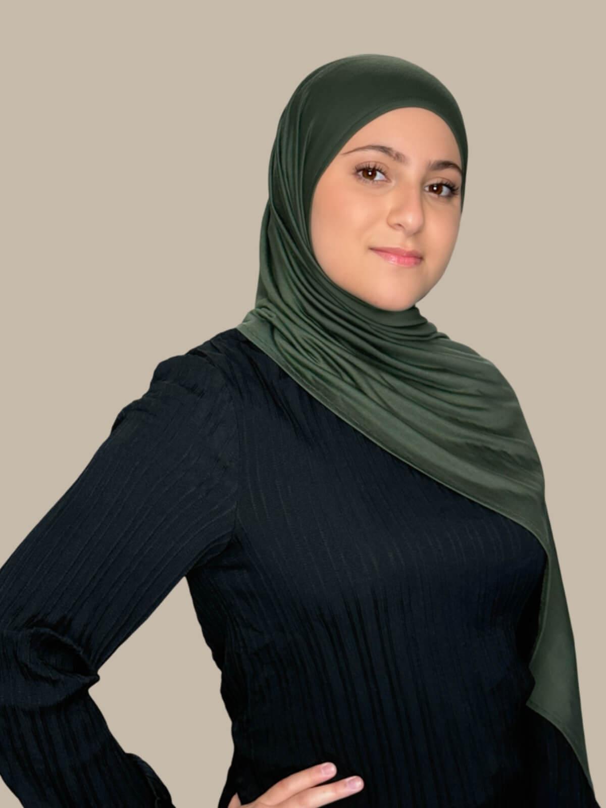 Army Green Pre-Sewn Jersey Hijab in Modish Girl size, side view on model with hijab draped over shoulder no pins