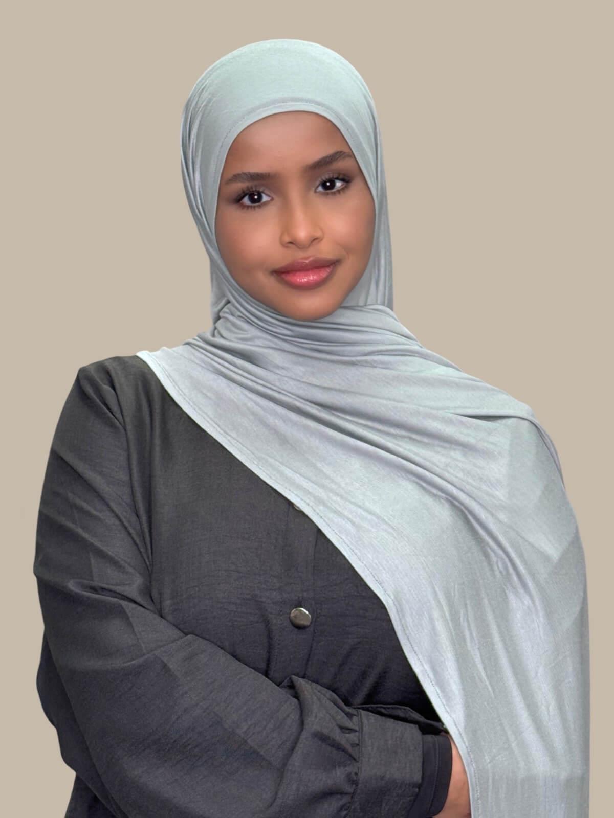 Stone Green Pre-Sewn Jersey Hijab, front view on model draped on shoulder