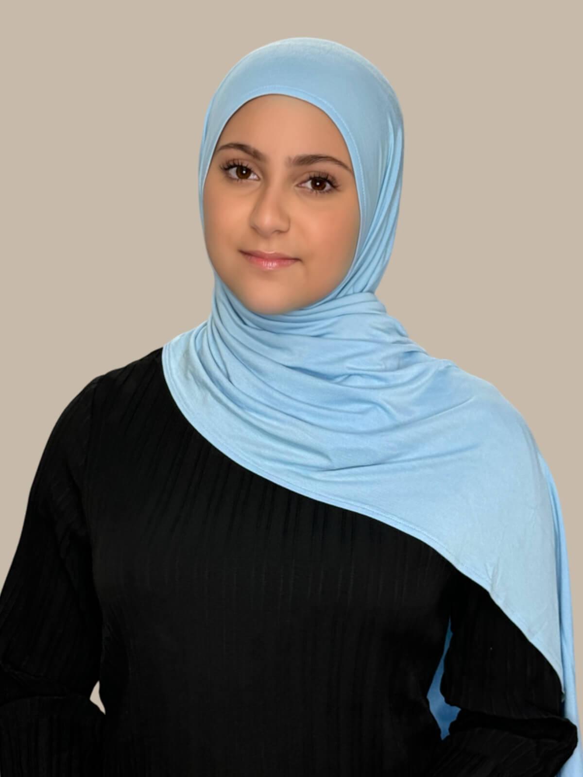 Baby Blue Pre-Sewn Jersey Hijab in Modish Girl size, front view on model with hijab draped over shoulders