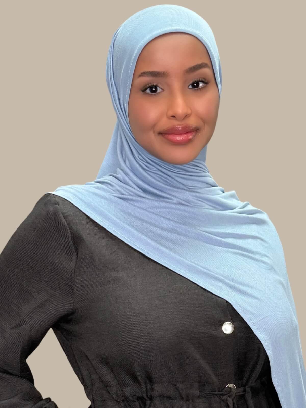 Dusty Blue Pre-Sewn Jersey Hijab, front view on model draped over shoulder