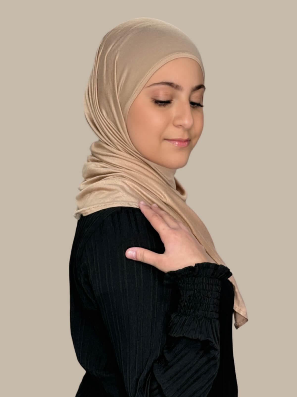 Warm Taupe Pre-Sewn Jersey Hijab in Modish Girl size, side view on model with hijab wrapped neatly around shoulders showing smooth fit and soft stretch fabric.
