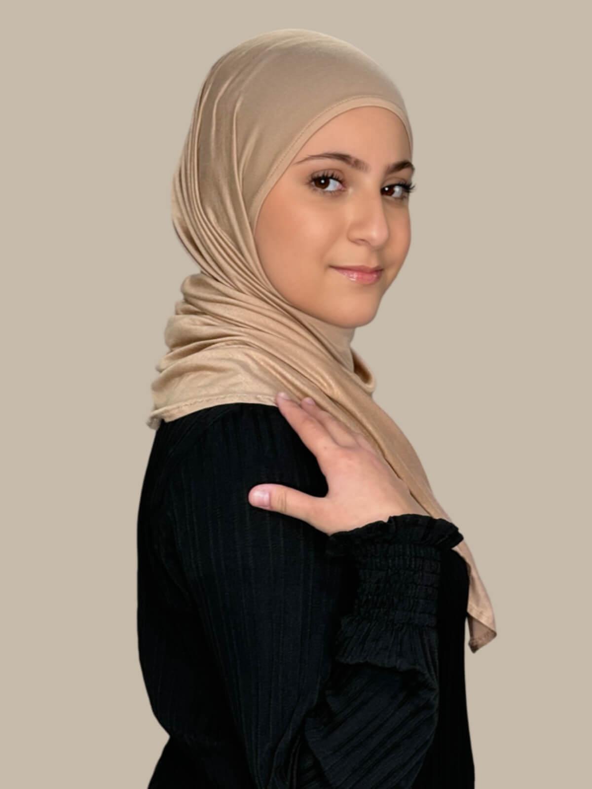 Warm Taupe Pre-Sewn Jersey Hijab in Modish Girl size, side view on model with hijab wrapped neatly around shoulders showing smooth fit and soft stretch fabric.