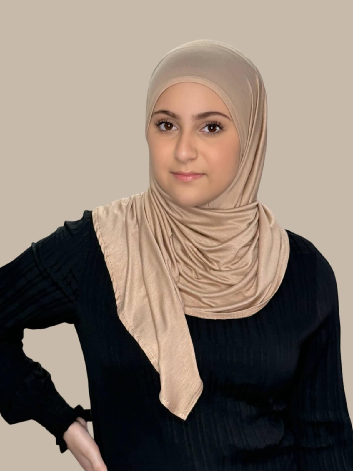Warm Taupe Pre-Sewn Jersey Hijab in Modish Girl size, front view on model with hijab wrapped neatly around shoulders showing smooth fit and soft stretch fabric. Effortless to style