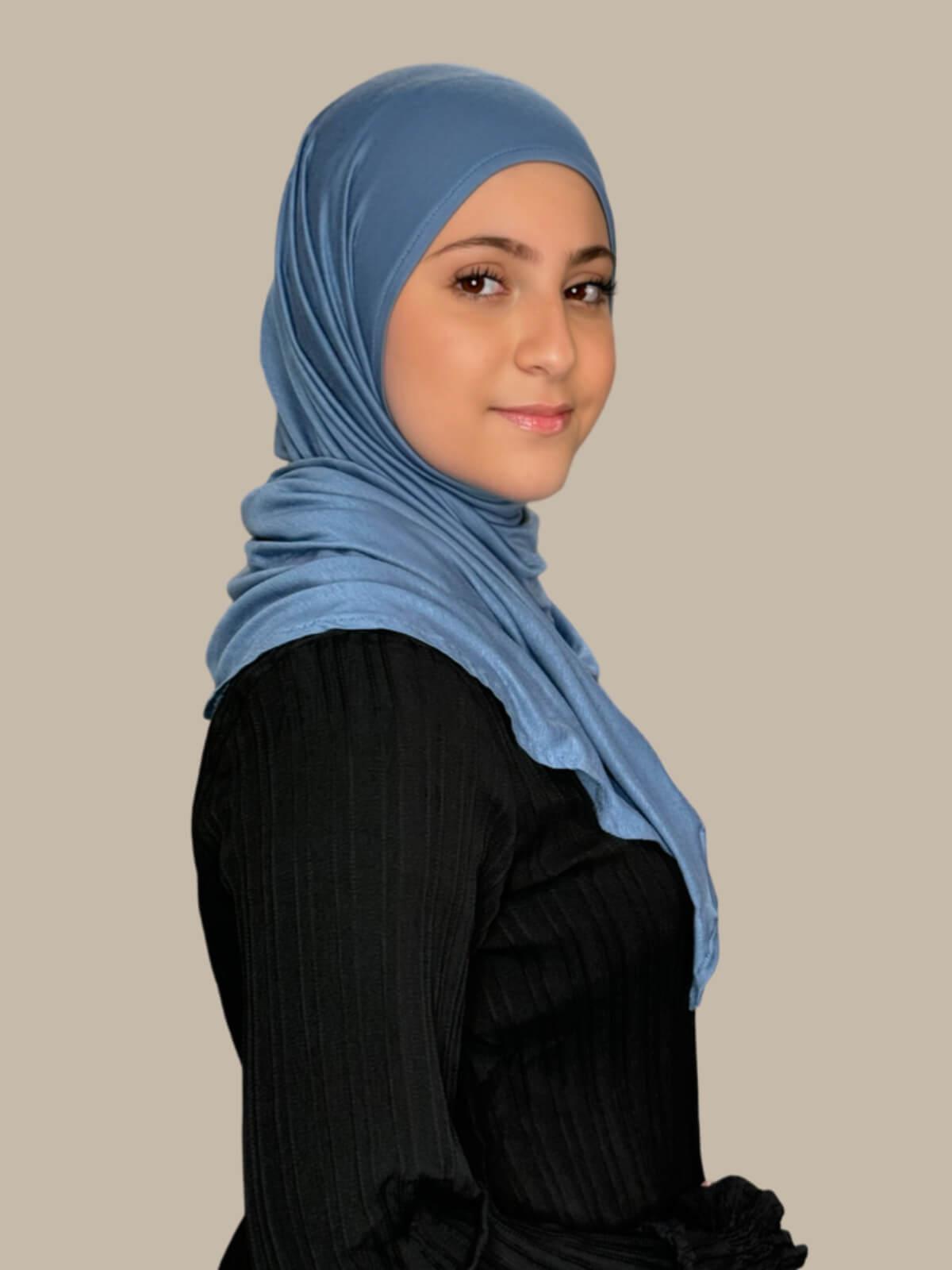 Blue Grey Pre-Sewn Jersey Hijab in Modish Girl size, side view on model with hijab wrapped neatly around shoulders showing smooth fit and soft stretch fabric.