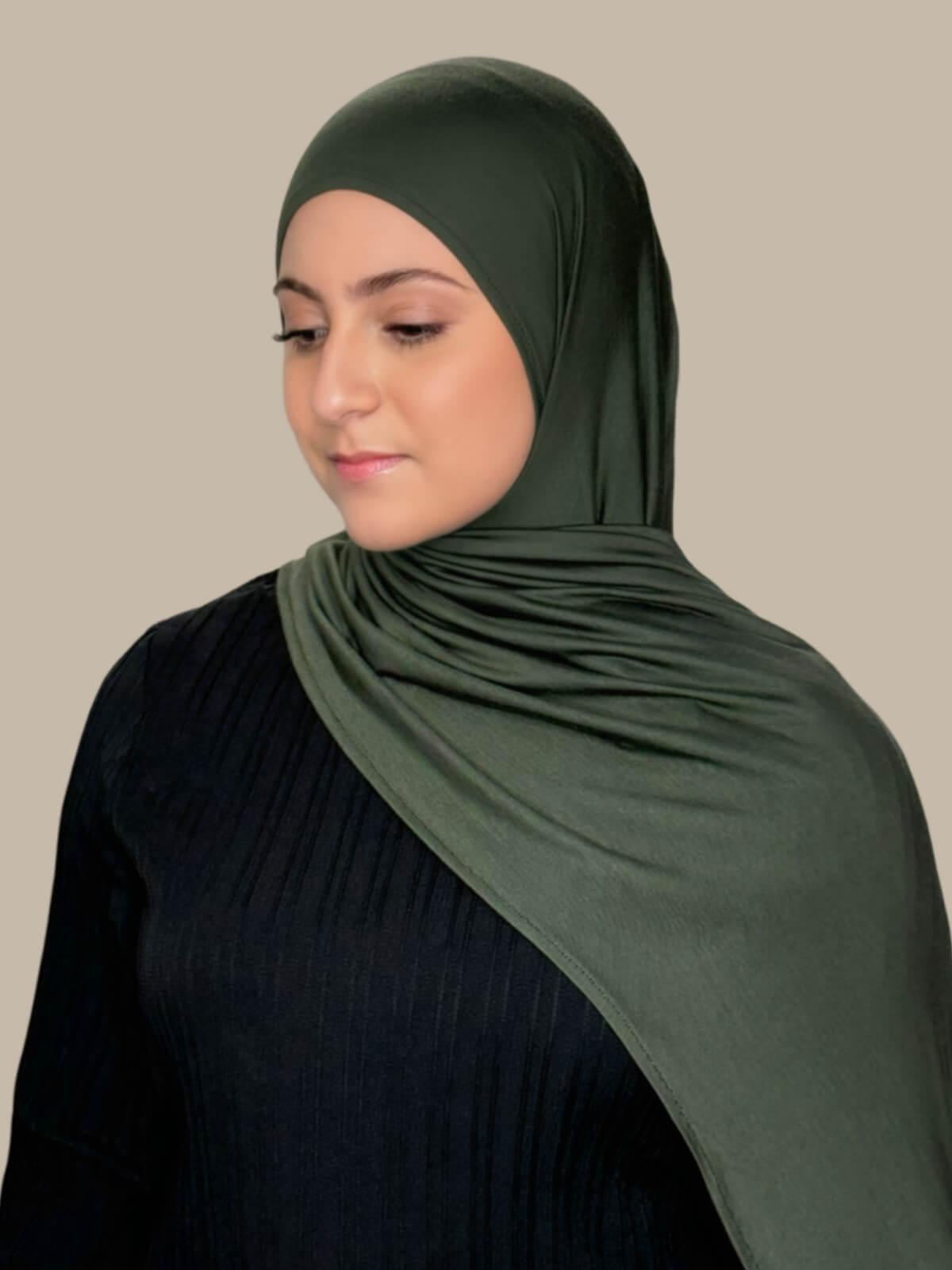 Army Green Pre-Sewn Jersey Hijab in Modish Girl size, side view on model with hijab draped over shoulder showing smooth fit and soft stretch