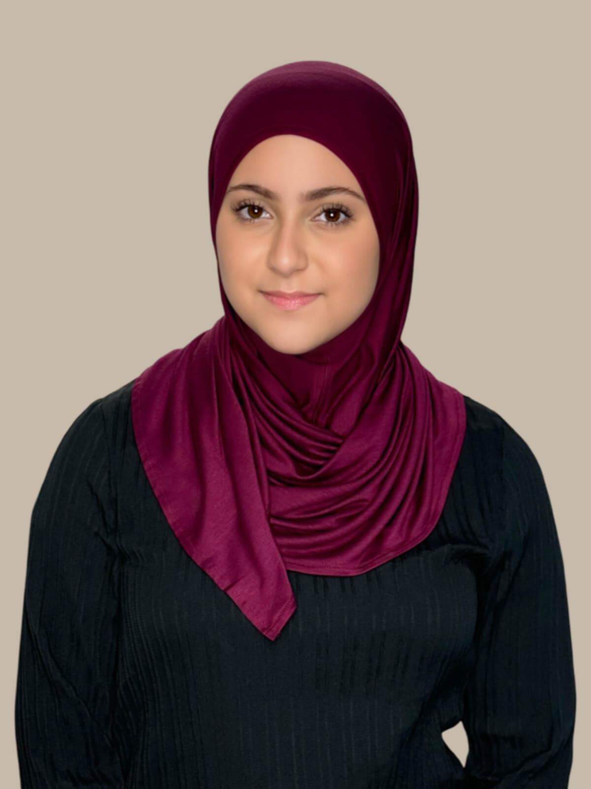 Burgundy Pre-Sewn Jersey Hijab in Modish Girl size, front view on model with hijab wrapped neatly around shoulders showing smooth fit and soft stretch fabric.