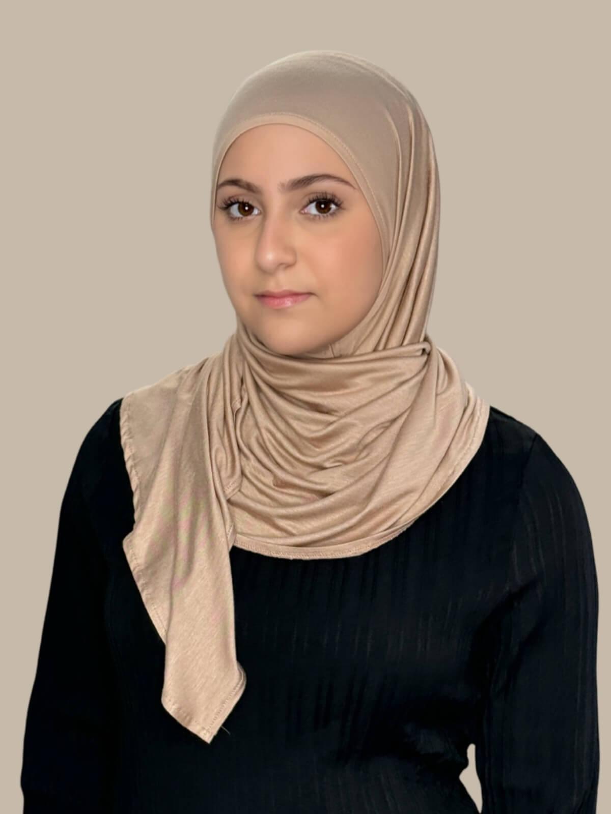 Warm Taupe Pre-Sewn Jersey Hijab in Modish Girl size, front view on model with hijab wrapped neatly around shoulders showing smooth fit and soft stretch fabric.