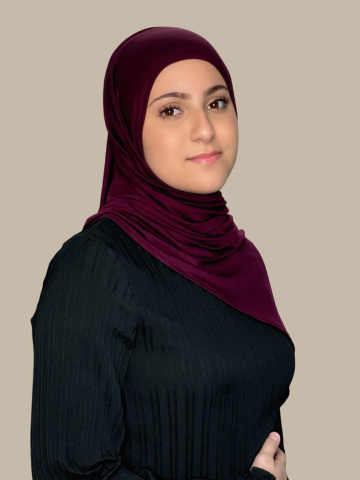 Wine Pre-Sewn Jersey Hijab in Modish Girl size, side view on model with hijab draped over shoulder