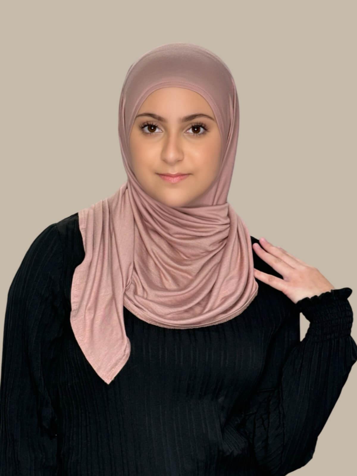 Dusty Rose Pre-Sewn Jersey Hijab in Modish Girl size, front view on model with hijab wrapped neatly around shoulders showing smooth fit and soft stretch fabric. No pins effortless