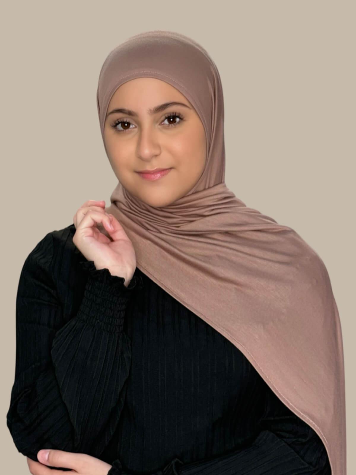 Pale Taupe Pre-Sewn Jersey Hijab in Modish Girl size, front view on model with hijab draped over shoulder showing smooth fit and soft stretch fabric.