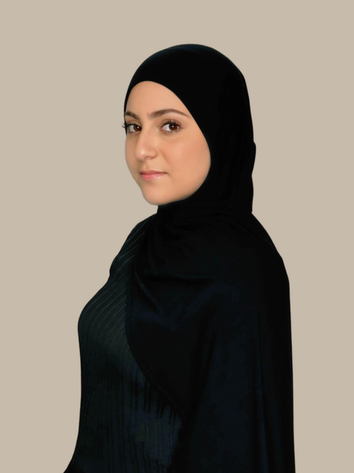 Black Pre-Sewn Jersey Hijab in Modish Girl size, side view on model draped over shoulder