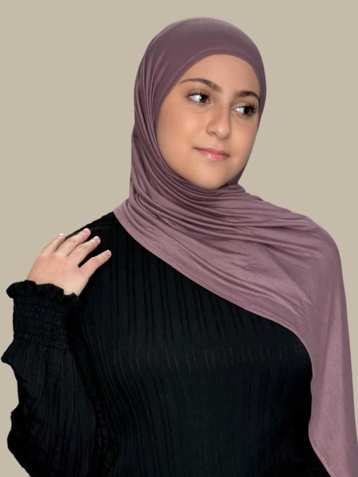 Rose Taupe Pre-Sewn Jersey Hijab in Modish Girl size, front view on model with hijab draped over shoulder no pins