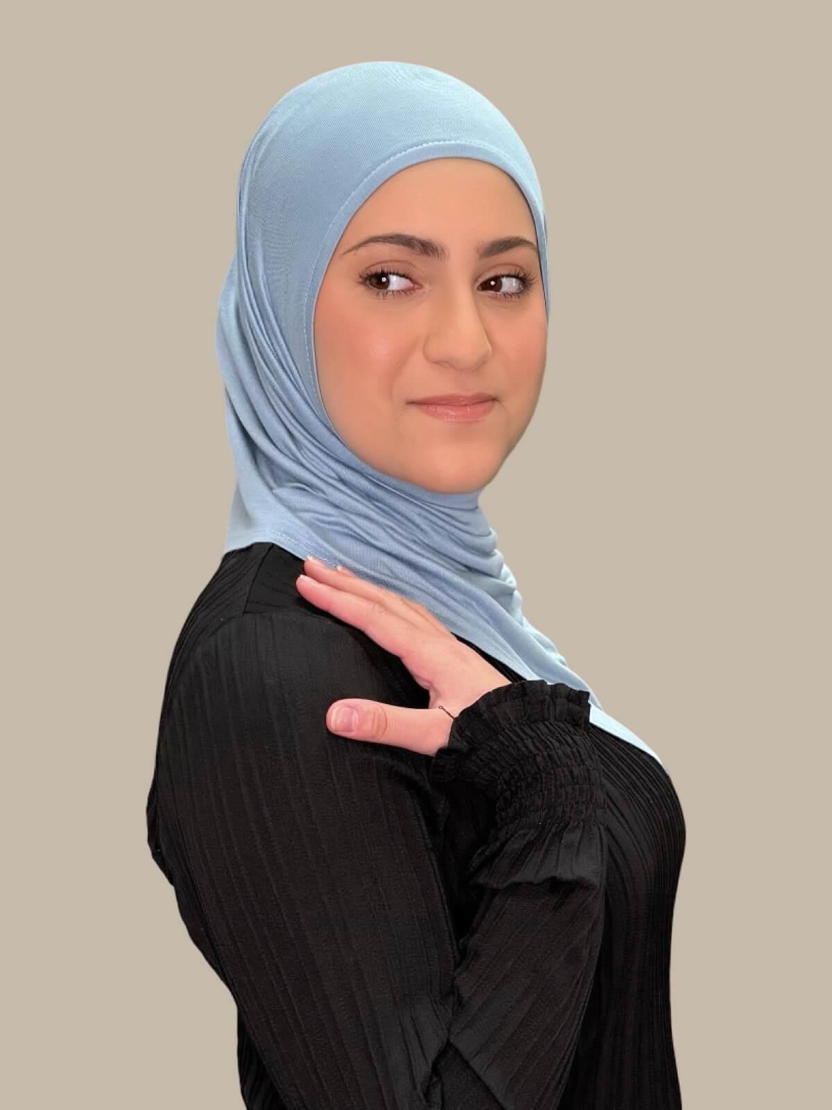 Dusty Blue Pre-Sewn Jersey Hijab in Modish Girl size, side view on model with hijab draped over shoulder 