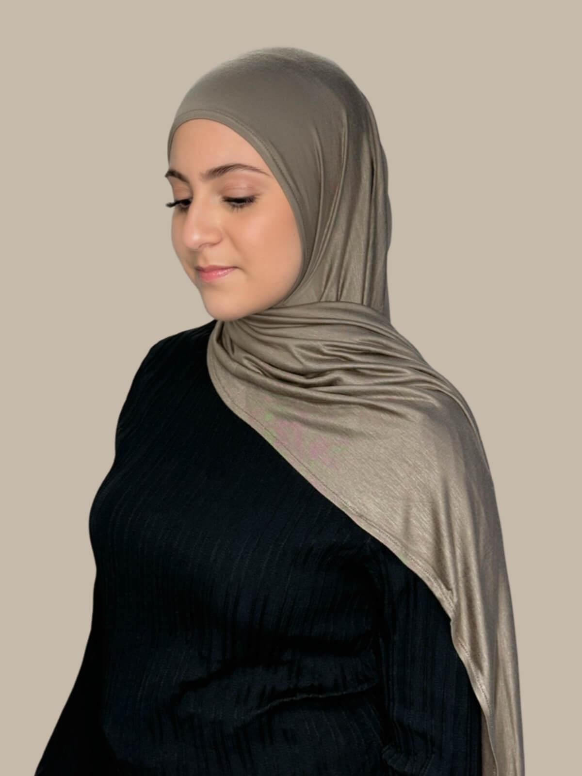 Sandstone Pre-Sewn Jersey Hijab in Modish Girl size, side view on model with hijab draped over shoulder showing smooth fit and soft stretch fabric.